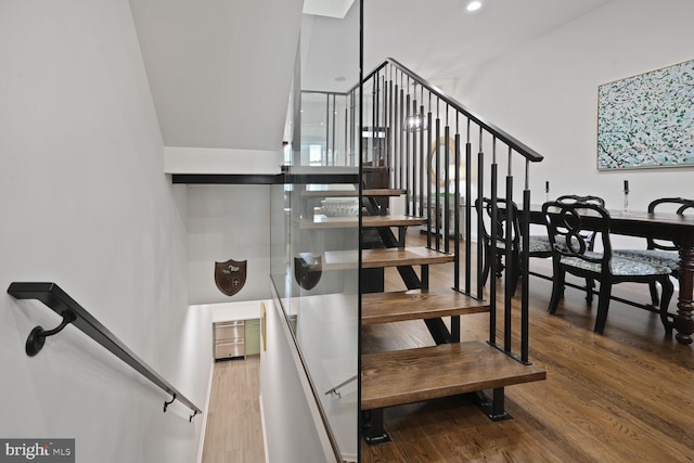 stairway with wood finished floors