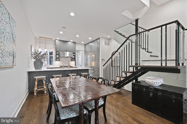 dining space featuring baseboards, visible vents, stairway, wood finished floors, and recessed lighting