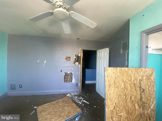 unfurnished room featuring a ceiling fan and visible vents