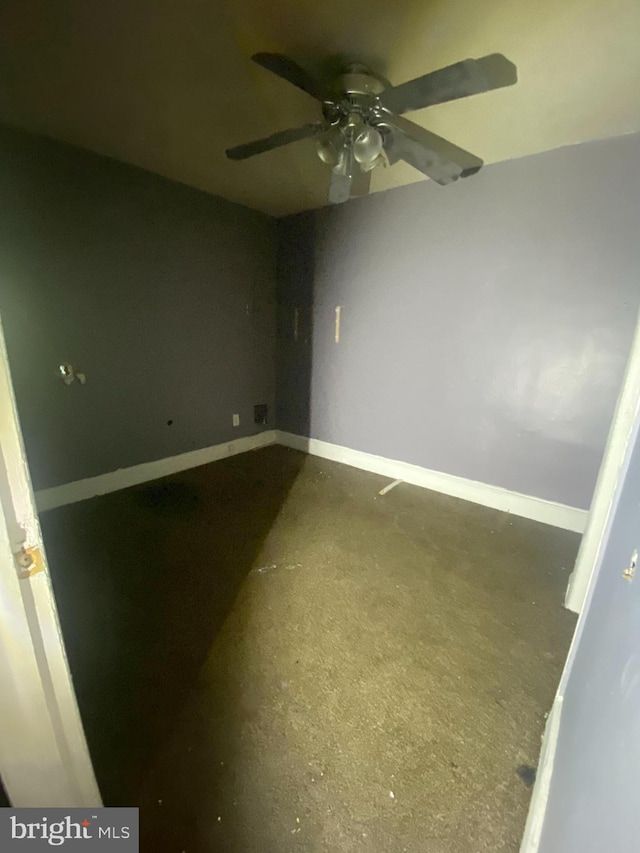 spare room with baseboards