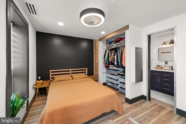 bedroom featuring recessed lighting, baseboards, visible vents, and light wood-style flooring