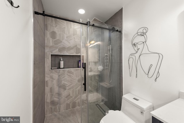 bathroom featuring toilet, recessed lighting, and a shower stall
