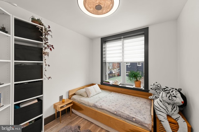 bedroom featuring wood finished floors