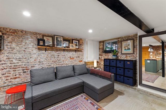 living room featuring brick wall