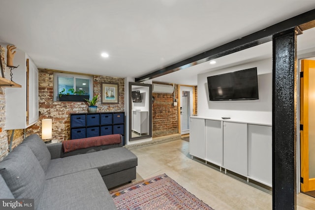 living area with recessed lighting, concrete flooring, a wall unit AC, and brick wall