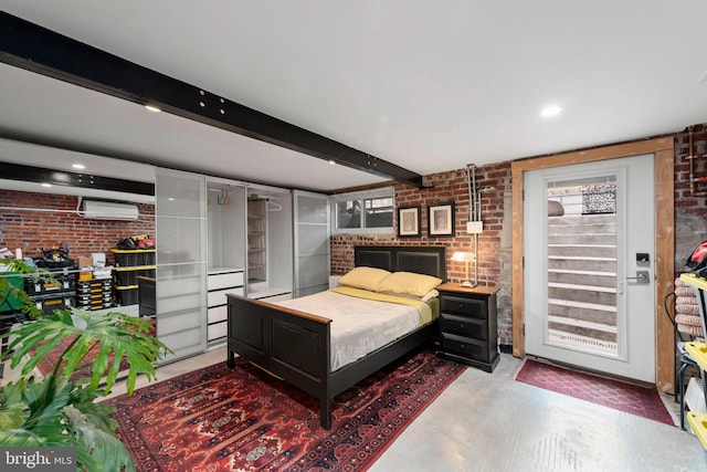bedroom with brick wall, a wall mounted air conditioner, beam ceiling, concrete floors, and recessed lighting