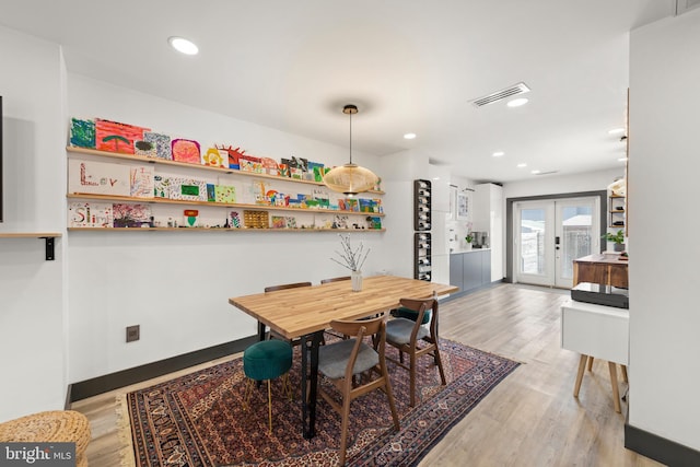 dining room featuring recessed lighting, light wood-style flooring, and visible vents