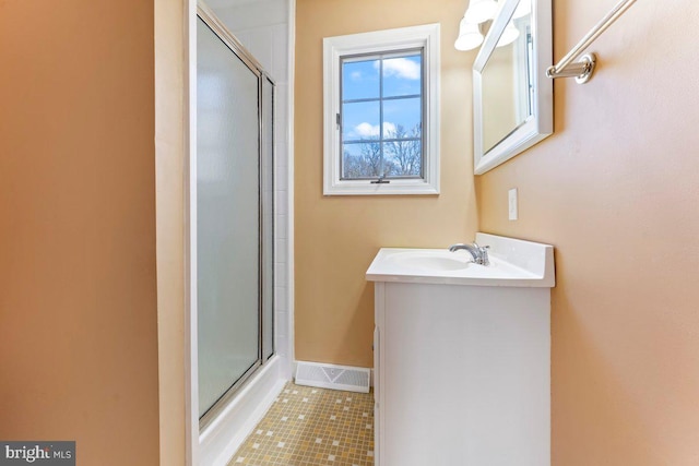 bathroom featuring tile patterned floors, visible vents, vanity, and an enclosed shower