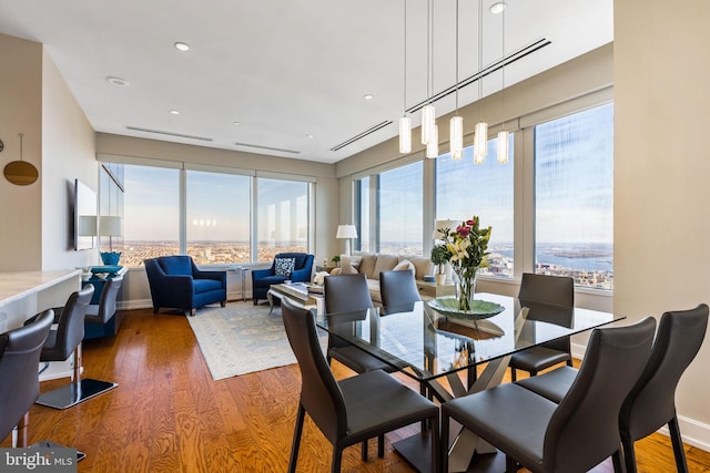 dining room with wood finished floors and baseboards