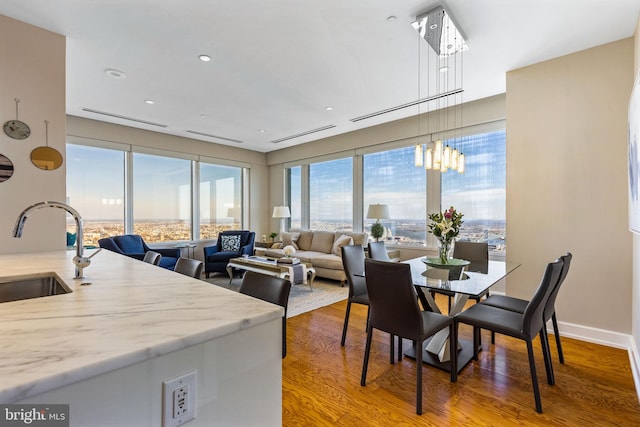 dining area featuring baseboards and wood finished floors