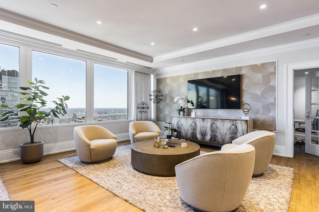 living area featuring ornamental molding, wood finished floors, and recessed lighting