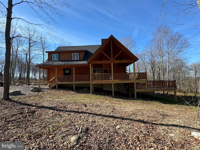 back of house featuring log exterior