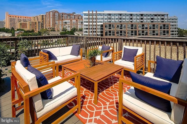 wooden deck featuring a view of city and outdoor lounge area