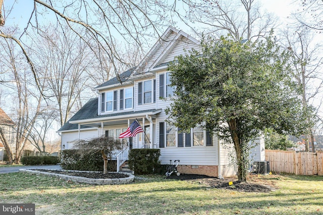 view of front of property with crawl space, a front yard, cooling unit, and fence