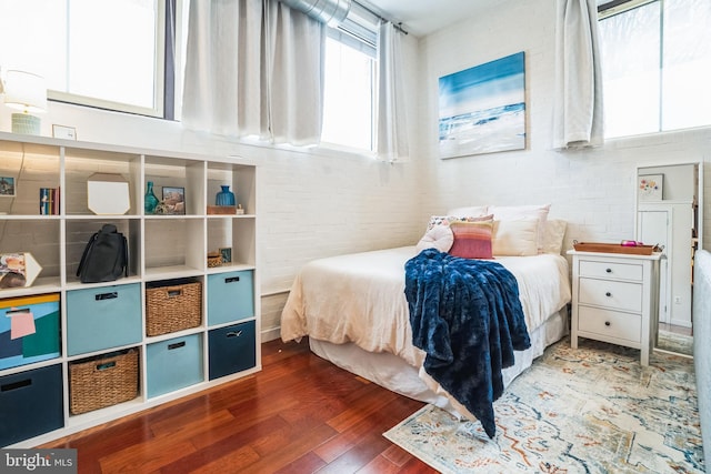 bedroom with wood finished floors