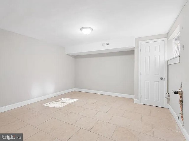 empty room featuring visible vents and baseboards