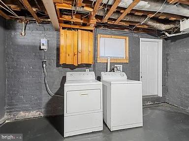 clothes washing area with laundry area and separate washer and dryer