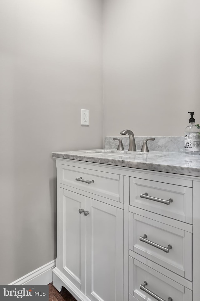 bathroom featuring vanity and baseboards