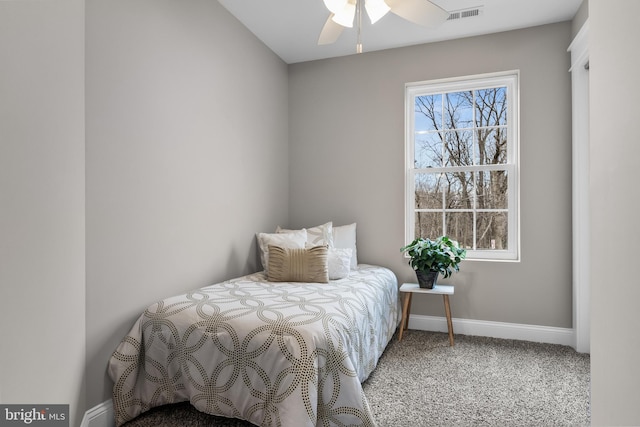 carpeted bedroom with visible vents and baseboards