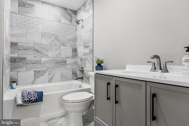 full bathroom featuring toilet, marble finish floor, shower / bathing tub combination, and vanity