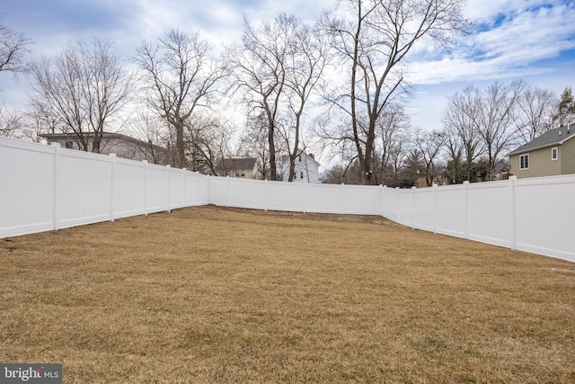 view of yard with a fenced backyard