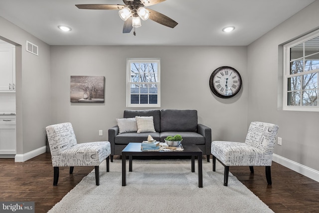 living room featuring recessed lighting, visible vents, dark wood finished floors, and baseboards