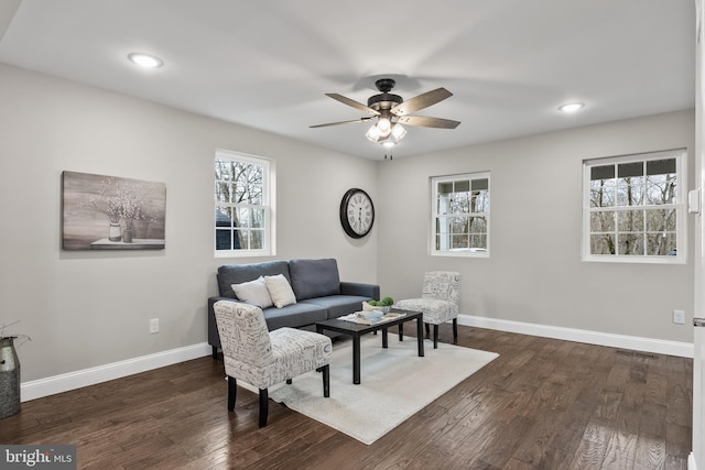 living area featuring dark wood-style floors, ceiling fan, baseboards, and recessed lighting