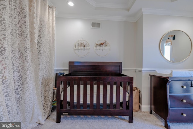 bedroom with ornamental molding, light colored carpet, and visible vents