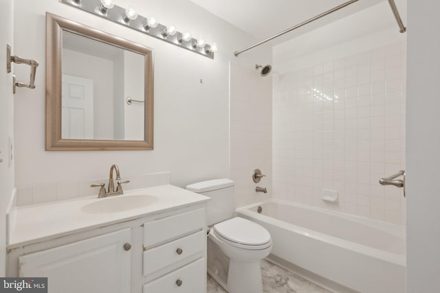 bathroom featuring vanity, toilet, tub / shower combination, and marble finish floor