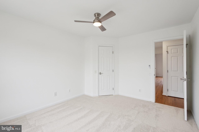 unfurnished bedroom featuring baseboards, ceiling fan, and carpet flooring