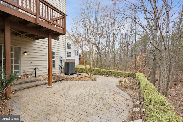 view of patio featuring a deck and central AC