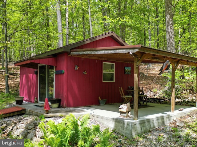 47 Timberline Dr, Lost River, WV 26810 - rear view of property with a view of trees and a patio area