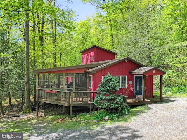 47 Timberline Dr, Lost River, WV 26810 - view of front of house featuring a wooden deck and a forest view