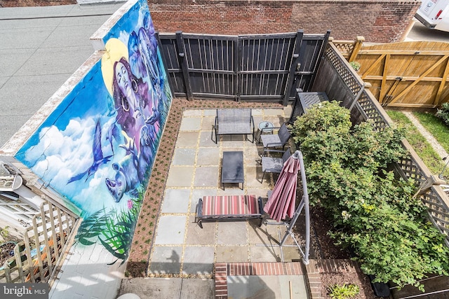 view of patio featuring fence