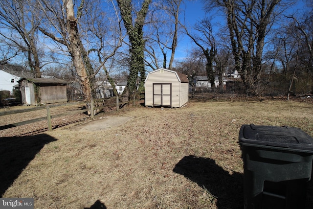 view of yard featuring an outbuilding and a storage unit