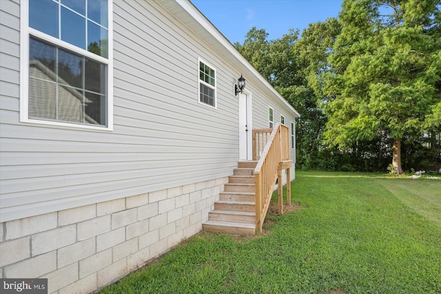 view of property exterior featuring a lawn