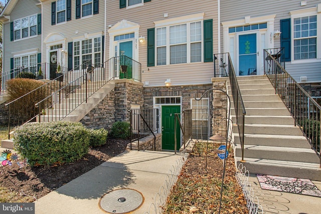 entrance to property featuring stone siding