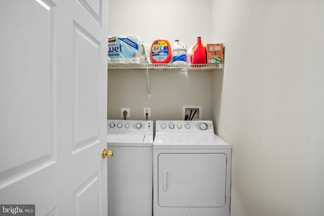 laundry area featuring laundry area and washer and clothes dryer