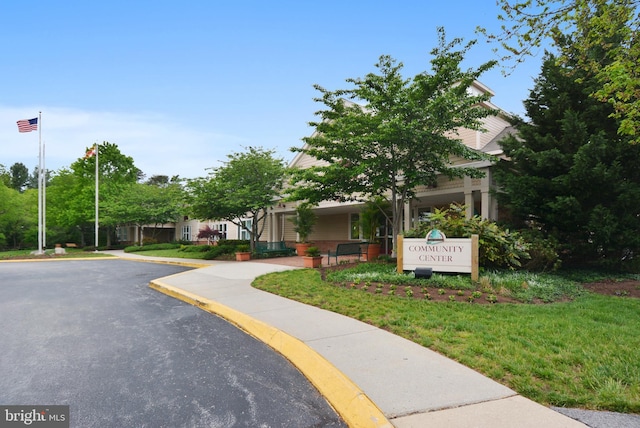 exterior space featuring curbs and sidewalks