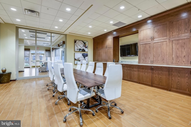 dining room with recessed lighting, french doors, visible vents, and light wood-style flooring