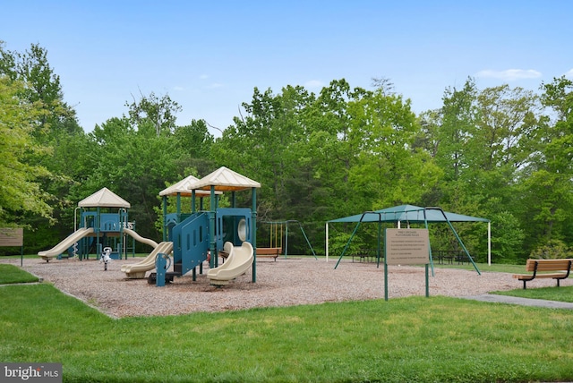 community play area featuring a lawn