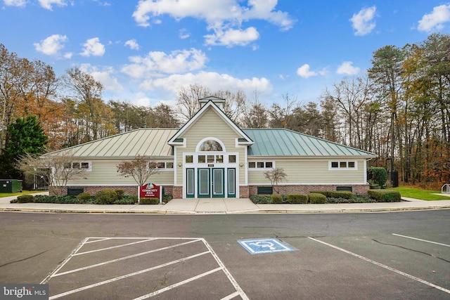 view of property featuring uncovered parking