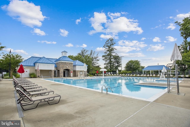 pool featuring a patio and fence