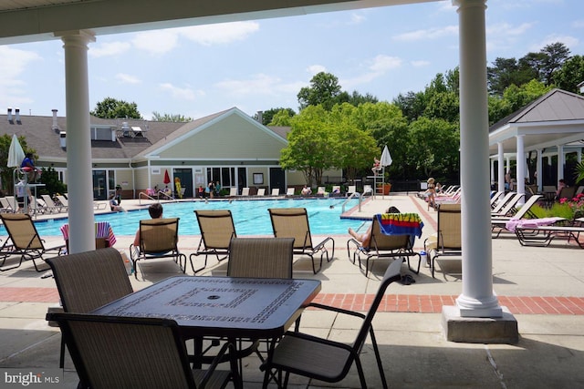 community pool featuring a patio and a gazebo