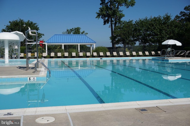 community pool featuring fence