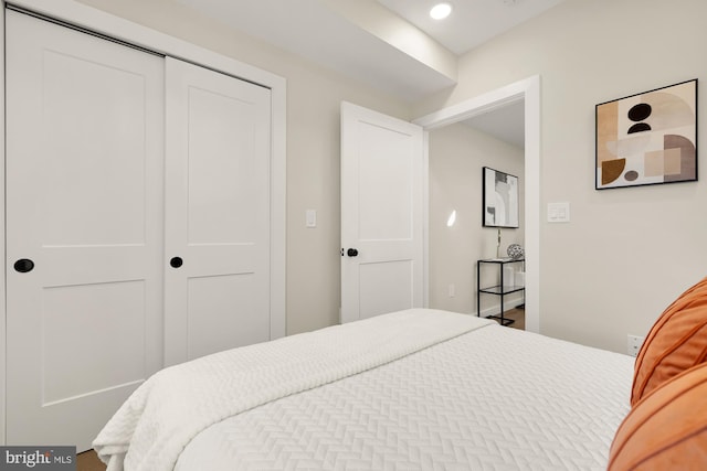 bedroom with a closet and recessed lighting