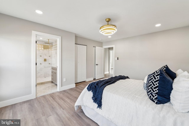 bedroom with ensuite bathroom, recessed lighting, wood finished floors, and baseboards