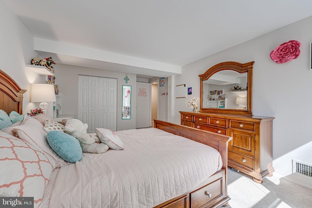 bedroom featuring a closet and carpet flooring