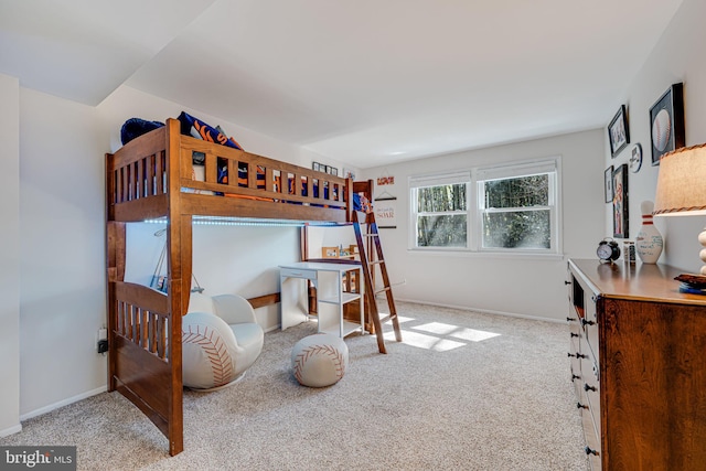 carpeted bedroom with baseboards