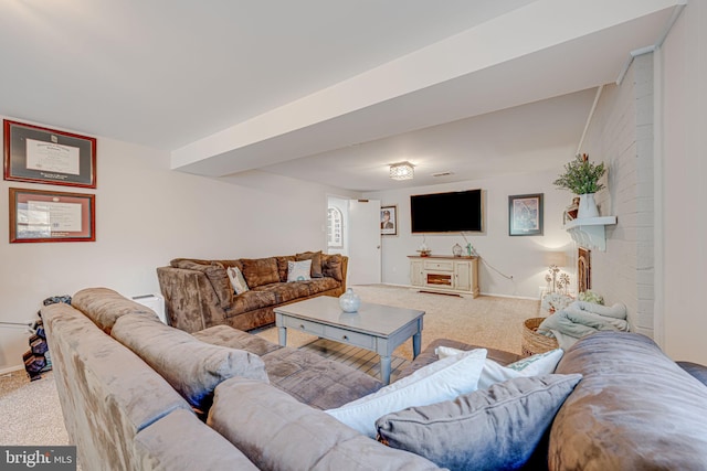 carpeted living area featuring baseboards